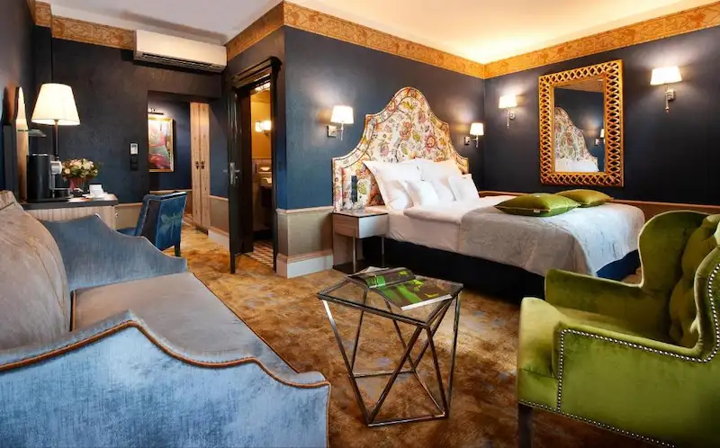 Chambre romantique et calme au Balthazar Design Hotel, situé dans la Vieille Ville de Cracovie